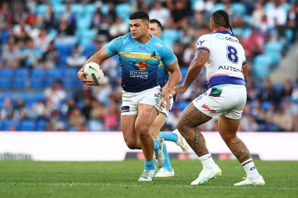 GOLD COAST, AUSTRALIA - JUNE 22: David Fifita of the Titans runs the ball during the round 16 NRL match between Gold Coast Titans and New Zealand Warriors at Cbus Super Stadium, on June 22, 2024, in Gold Coast, Australia. (Photo by Chris Hyde/Getty Images)