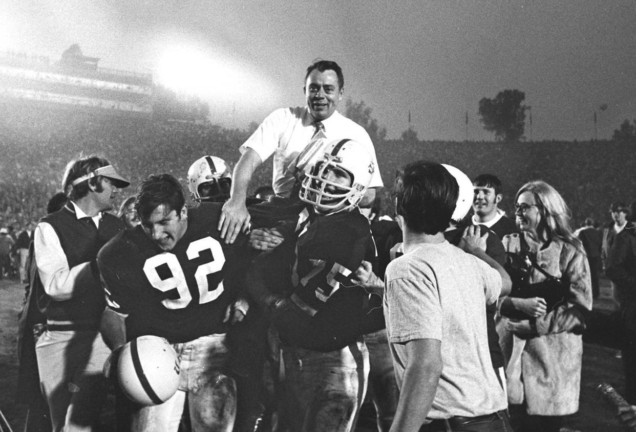 FILE - In this In this Jan. 1, 1971, file photo, Stanford coach John Ralston is carried off the field by his players after they defeated the Ohio State Buckeyes in the NCAA college football Rose Bowl game in Pasadena, Calif. Ralston, the former Stanford and Denver Broncos coach, died Saturday, Sept. 14, 2019, in Sunnyvale, Calif. He was 92. (AP Photo/File)