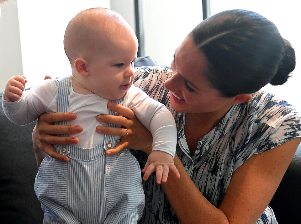 Meghan, Meghan Markle holds baby Archie as he meets Archbishop Desmond Tutu in Cape Town on September 25, 2019 [Photo: Getty]