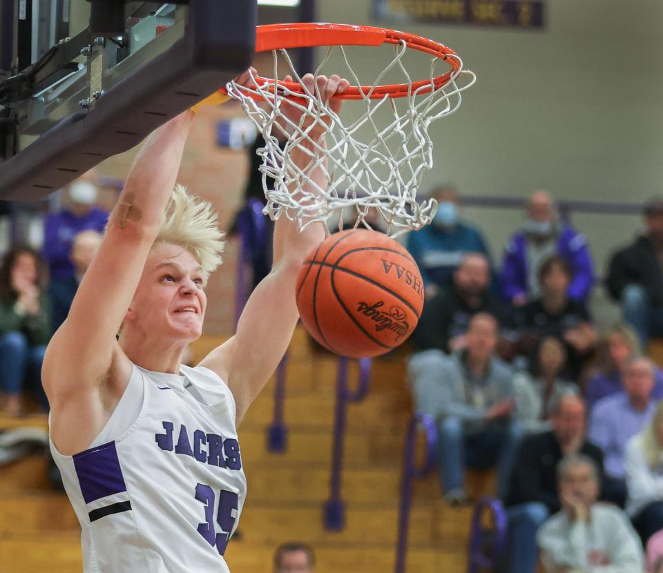 Jackson’s Owen Woolbert slams against Hudson on Wednesday, Feb. 23, 2022.