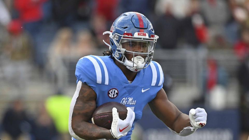 Mississippi running back Quinshon Judkins (4) runs the ball during the first half of an NCAA college football game against Alabama in Oxford, Miss., Saturday, Nov. 12, 2022. (AP Photo/Thomas Graning)