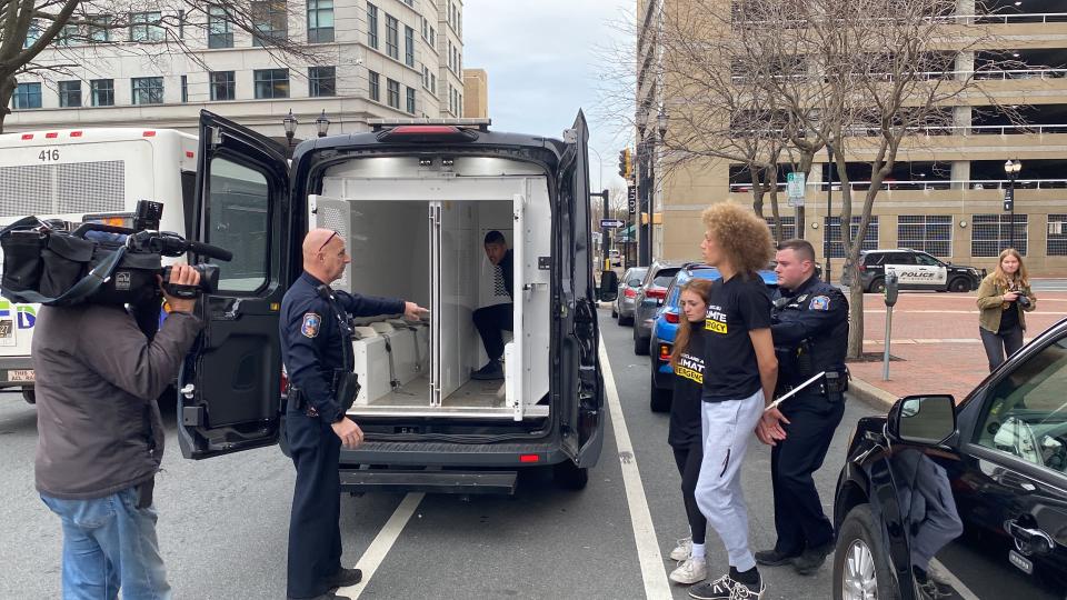 Several people were lead away in handcuffs from President Joe Biden's 2024 campaign headquarters in Wilmington on Monday, Feb. 12, 2024, during a climate protest.