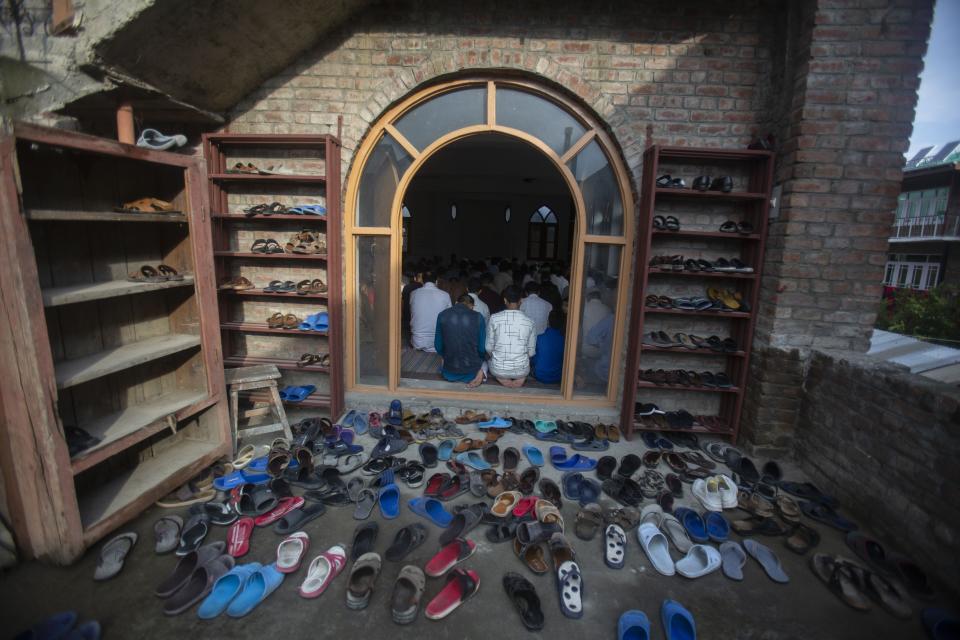 Kashmiri Muslims offer Eid prayers inside a local mosque in downtown Srinagar, Indian controlled Kashmir, Saturday, Aug. 1, 2020. Muslims worldwide marked the the Eid al-Adha holiday over the past days amid a global pandemic that has impacted nearly every aspect of this year's celebrations. (AP Photo/Mukhtar Khan)