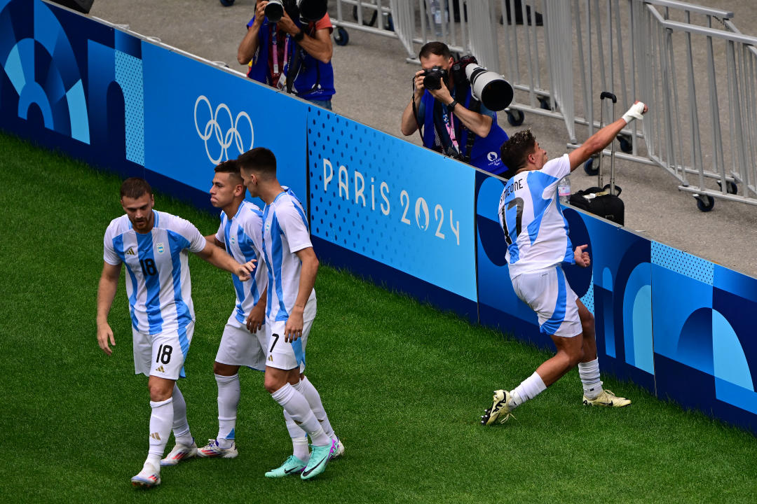 Argentina's forward #17 Giuliano Simeone celebrates after Argentina's midfielder #11 Claudio Echeverri scored their teams second goal in the men's group B football match between Ukraine and Argentina during the Paris 2024 Olympic Games at the Lyon Stadium in Lyon on July 30, 2024. (Photo by Olivier CHASSIGNOLE / AFP) (Photo by OLIVIER CHASSIGNOLE/AFP via Getty Images)