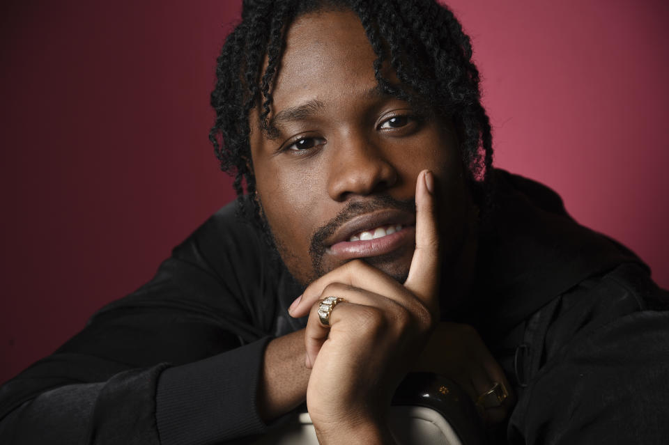 In this Nov. 30, 2018 photo, Shameik Moore, a cast member in "Spider-man: Into the Spider-Verse," poses for a portrait at the Four Seasons Hotel in Los Angeles. (Photo by Chris Pizzello/Invision/AP)