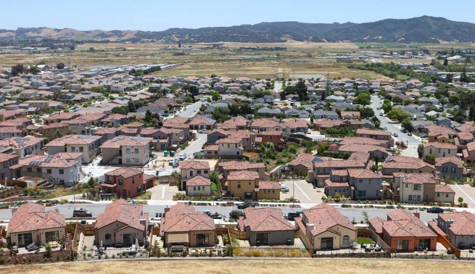 A photo taken June 20, 2023, shows the last units of the Toscano housing development finished in the foreground and Serra Meadows in the background, wrapping around Margarita Avenue in San Luis Obispo.