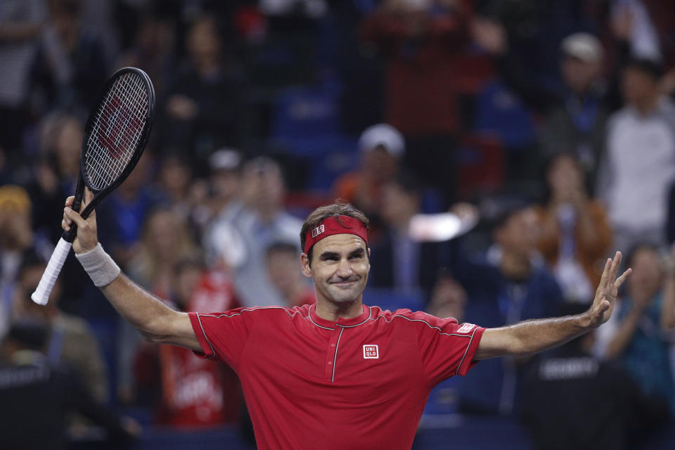 Roger Federer of Switzerland gestures to spectators after defeating Albert Ramos-Vinolas of Spain in the men's singles match at the Shanghai Masters tennis tournament at Qizhong Forest Sports City Tennis Center in Shanghai, China, Tuesday, Oct. 8, 2019. (AP Photo/Andy Wong)