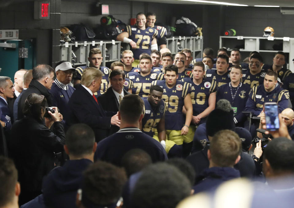 President Donald Trump greets the Navy football team in Philadelphia, Saturday, Dec. 14, 2019, before the Army-Navy college football game. (AP Photo/Jacquelyn Martin)