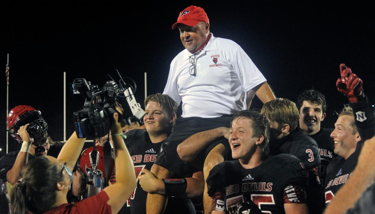 Fyffe players hoist coach Paul Benefield on their shoulders and carry him off the field after beating Sylvania 49-20 Friday, Sept. 11, 2020, at Paul Benefield Stadium. The win was the 300th of Benefield's career.