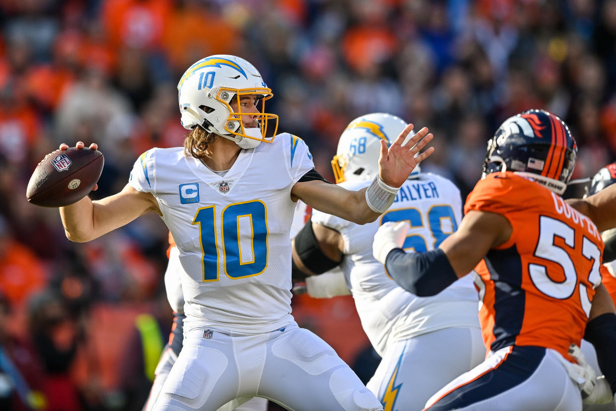 DENVER, CO - JANUARY 8: Los Angeles Chargers quarterback Justin Herbert (10) passes in the first quarter during a game between the Los Angeles Chargers and the Denver Broncos at Empower Field at Mile High on January 8, 2023 in Denver, Colorado. (Photo by Dustin Bradford/Icon Sportswire via Getty Images)