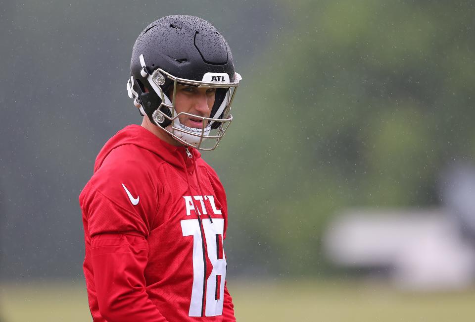 Quarterback Kirk Cousins #18 of the Atlanta Falcons looks on during OTA offseason workouts at the Atlanta Falcons training facility on May 14, 2024 in Flowery Branch, Georgia.