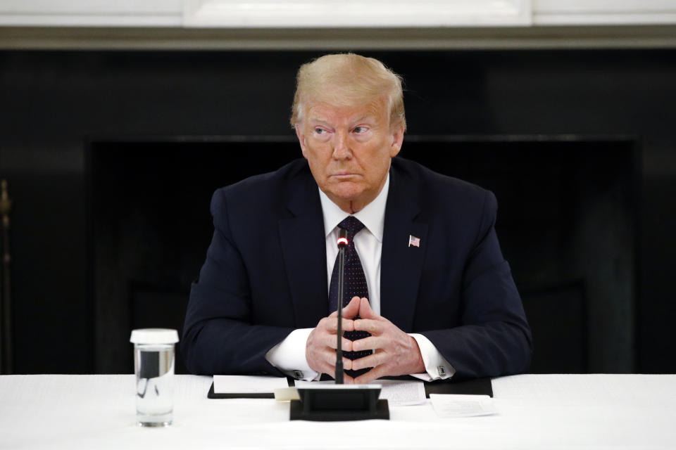 President Donald Trump listens during a roundtable discussion with law enforcement officials, Monday, June 8, 2020, in the State Dining Room of the White House in Washington. (AP Photo/Patrick Semansky)