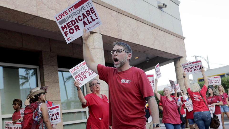 Supporters of with National Nurses United demonstrate in Miami. (Lynne Sladky/AP)