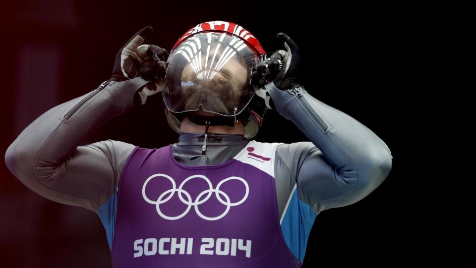 Gregory Carigiet from Switzerland prepares for a Men's Single luge training run ahead of the 2014 Winter Olympics, Wednesday, Feb. 5, 2014, in Krasnaya Polyana, Russia. (AP Photo/Michael Sohn)