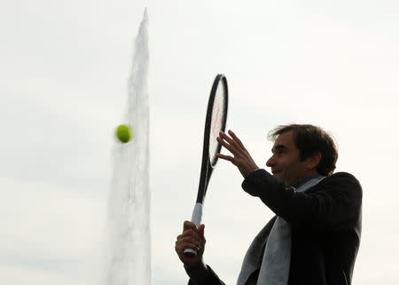 Switzerland's Roger Federer returns the ball to Bjorn Borg of Sweden during a tennis session to promote the Laver Cup tennis tournament on a temporary court on the banks of Lake Geneva in Geneva, Switzerland February 8,2019. REUTERS/Arnd Wiegmann