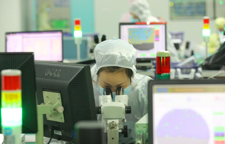 NANTONG, CHINA - MARCH 17 2021: An employee works at Jiejie Microelectronics, a manufacturer of semiconductors, in Nantong in east China's Jiangsu province Wednesday, March 17, 2021. (Photo credit should read Feature China/Barcroft Media via Getty Images)