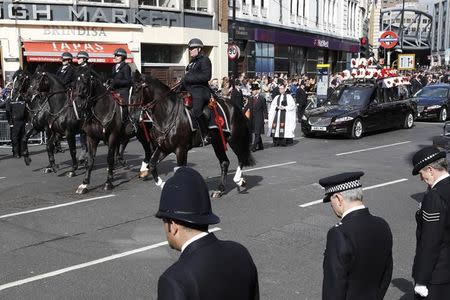 The coffin of PC Keith Palmer, who was killed in the recent Westminster attack, is driven away after his funeral in Southwark Cathedral in central London, Britain April 10, 2017. REUTERS/Stefan Wermuth