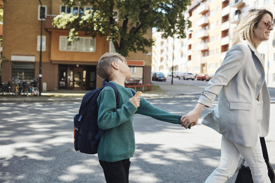 working mother taking son to school