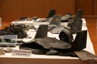 Remains of the missiles which Saudi government says were used to attack an Aramco oil facility, are displayed during a news conference in Riyadh