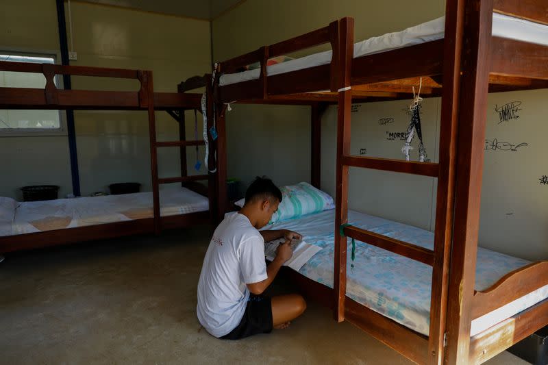 A drug rehab patient writes on a notebook at the Mega Drug Abuse Treatment and Rehabilitation Center, in Nueva Ecija province, north of Manila