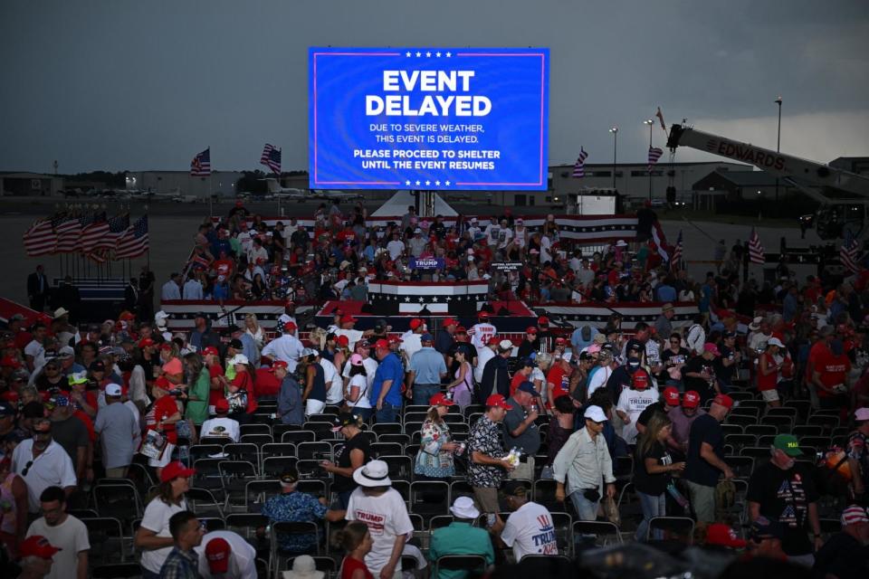 PHOTO: Supporters of former President Donald Trump are asked to move to a shelter as a storm moves in at a campaign rally in Wilmington, NC, April 20, 2024.  (Jim Watson/AFP via Getty Images)