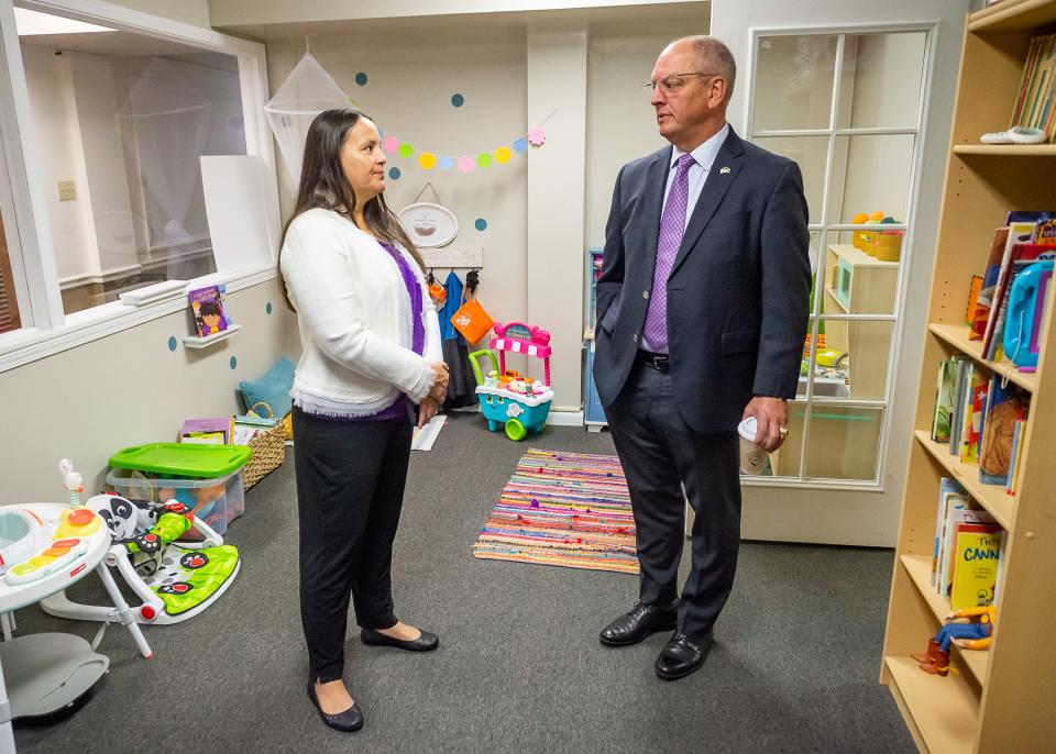 Louisiana Gov. John Bel Edwards meets with Faith House Executive Director Billi Lecombe during his visit Monday to discuss a recent government grant. The governor's visit is part of a statewide tour marking the five-year anniversary of his criminal justice reform.