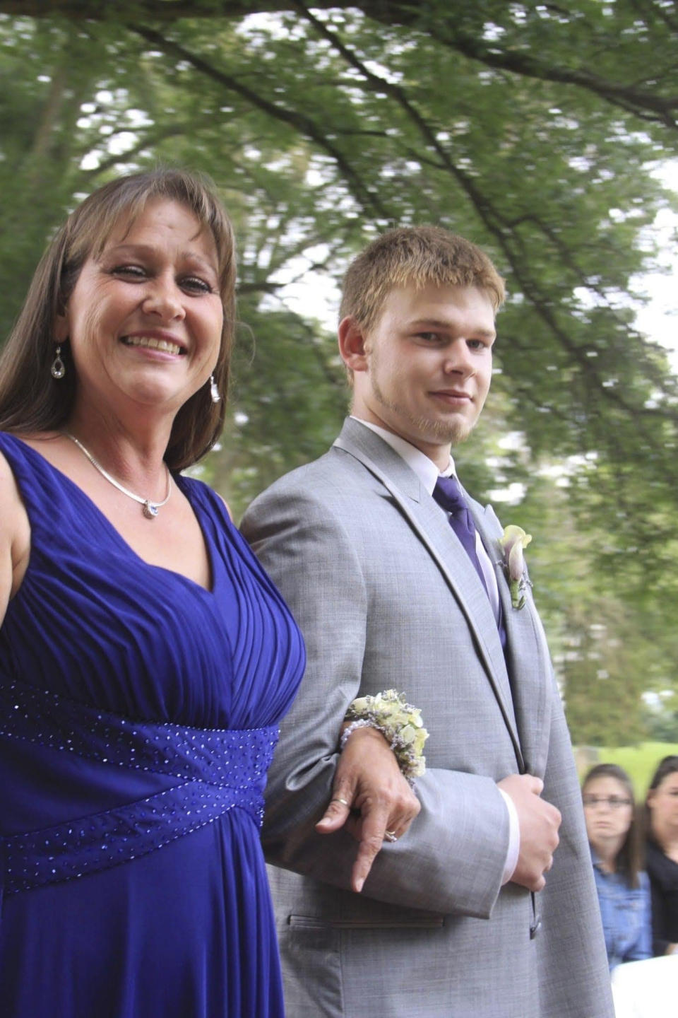 This 2012 family photo shows Austin Hunter Turner with his mother, Karen Goodwin, at the wedding of her oldest son. Turner died in 2017, at the age of 23, after an encounter with the Bristol Police Department. His family has raised questions about the Tennessee Bureau of Investigation’s review of Hunter's death and the local prosecutor’s decision not to charge police. (Kim Rutledge via AP)