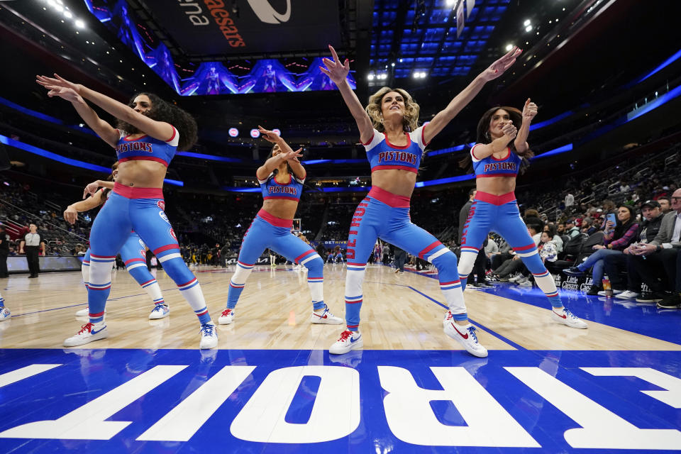 Members of the Detroit Pistons dance team perform during the first half of an NBA basketball game against the Indiana Pacers, Monday, Dec. 11, 2023, in Detroit. (AP Photo/Carlos Osorio)