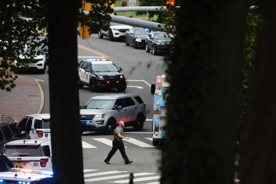A heavy law enforcement and first responser presence is seen on South Street near the Bell Tower on the campus of the University of North Carolina in Chapel Hill, N.C. Monday afternoon, Aug. 28, 2023 after a report of a “armed and dangerous person”.