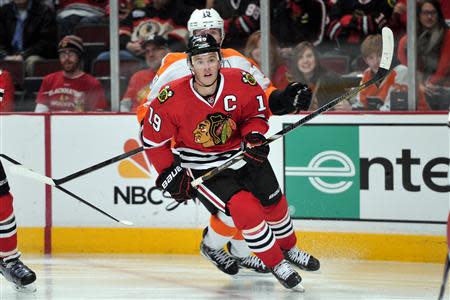 Dec 11, 2013; Chicago, IL, USA; Chicago Blackhawks center Jonathan Toews (19) looks for the puck against the Philadelphia Flyers during the third period at the United Center. The Blackhawks beat the Flyers 7-2. Rob Grabowski-USA TODAY Sports