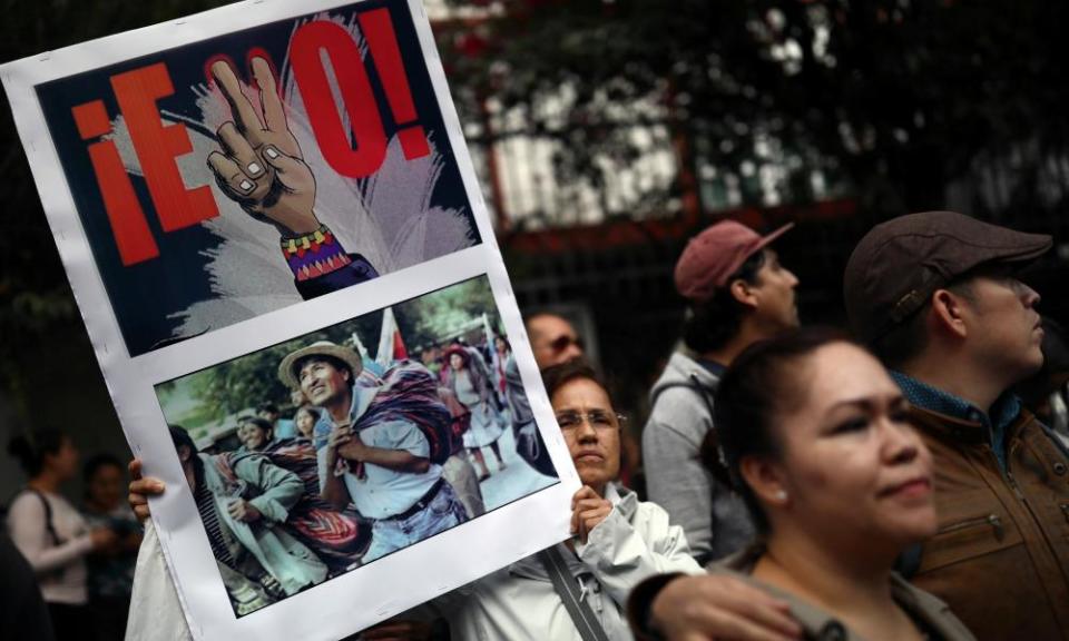 People take part in a demonstration in support of Bolivian President Evo Morales after he announced his resignation on Sunday