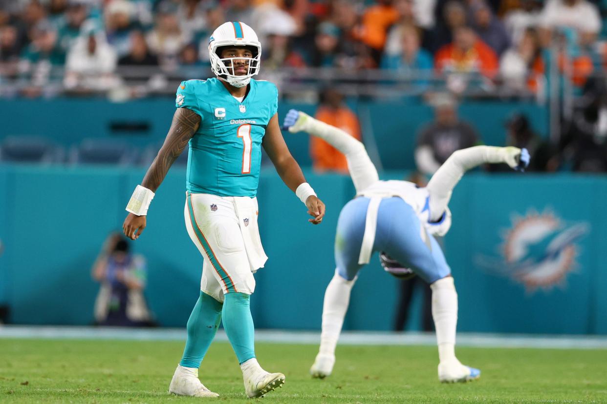 Tua Tagovailoa #1 of the Miami Dolphins reacts in the fourth quarter against the Tennessee Titans at Hard Rock Stadium on December 11, 2023 in Miami Gardens, Florida.