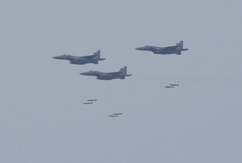 South Korean air force F-15K fighters drop bombs during South Korea-U.S. joint military drills at Seungjin Fire Training Field in Pocheon, South Korea, Thursday, May 25, 2023. The South Korean and U.S. militaries held massive live-fire drills near the border with North Korea on Thursday, despite the North's warning that it won't tolerate what it calls such a hostile invasion rehearsal on its doorstep. (AP Photo/Ahn Young-joon)