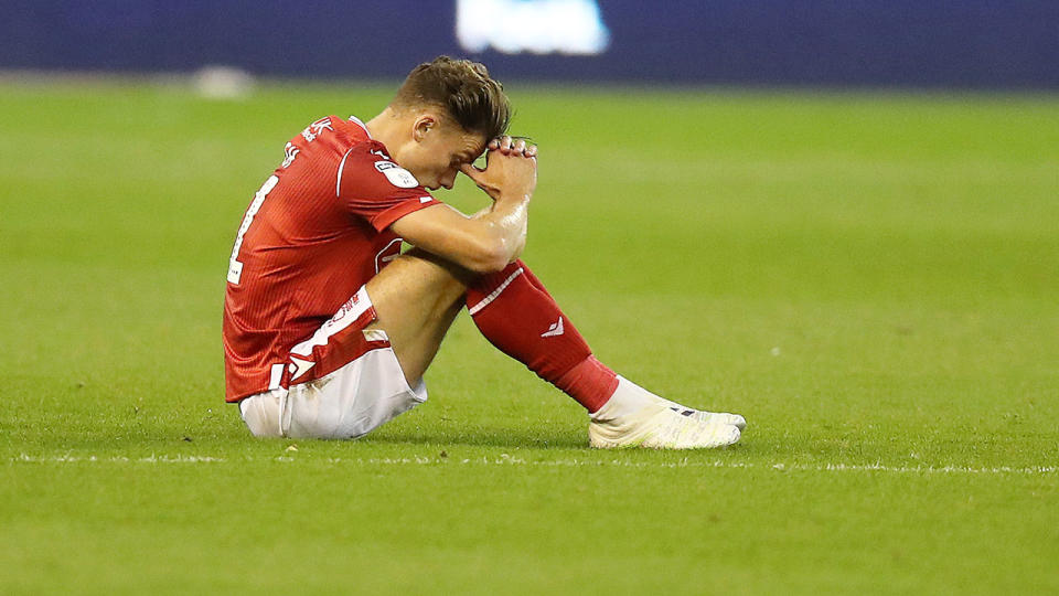 Matty Cash of Nottingham Forest looks dejected after they fail to qualify for the play-offs.