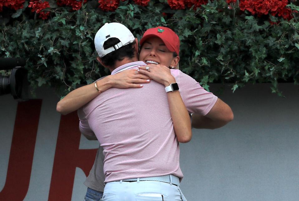 ATLANTA, GEORGIA - AUGUST 25: Rory McIlroy of Northern Ireland celebrates with his wife Erica Stoll after winning during the final round of the TOUR Championship at East Lake Golf Club on August 25, 2019 in Atlanta, Georgia. (Photo by Streeter Lecka/Getty Images)