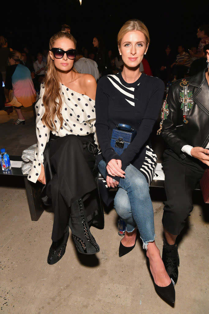 <p>Paris Hilton and Nicky Hilton Rothschild attend the Monse Spring 2019 show during New York Fashion Week at SIR Stage 37 on September 7, 2018 in New York City. (Photo: Dia Dipasupil/Getty Images) </p>