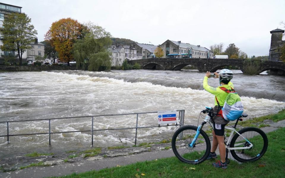 High water levels on the River Kent in Kendal, Cumbria, where the Met office has warned of life-threatening flooding - Owen Humphreys/PA