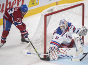 Montreal Canadiens' Tyler Toffoli moves in on New York Rangers goaltender Igor Shesterkin during the first period of an NHL hockey game Saturday, Oct. 16, 2021, in Montreal. (Graham Hughes/The Canadian Press via AP)