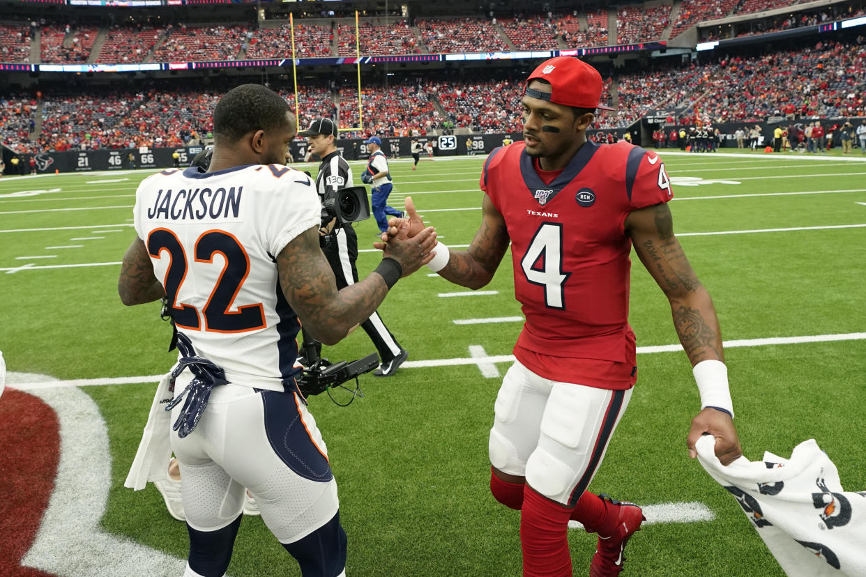 Denver Broncos strong safety Kareem Jackson (22) and Houston Texans quarterback Deshaun Watson (4) shake hands prior to an NFL football game Sunday, Dec. 8, 2019, in Houston. (AP Photo/David J. Phillip)