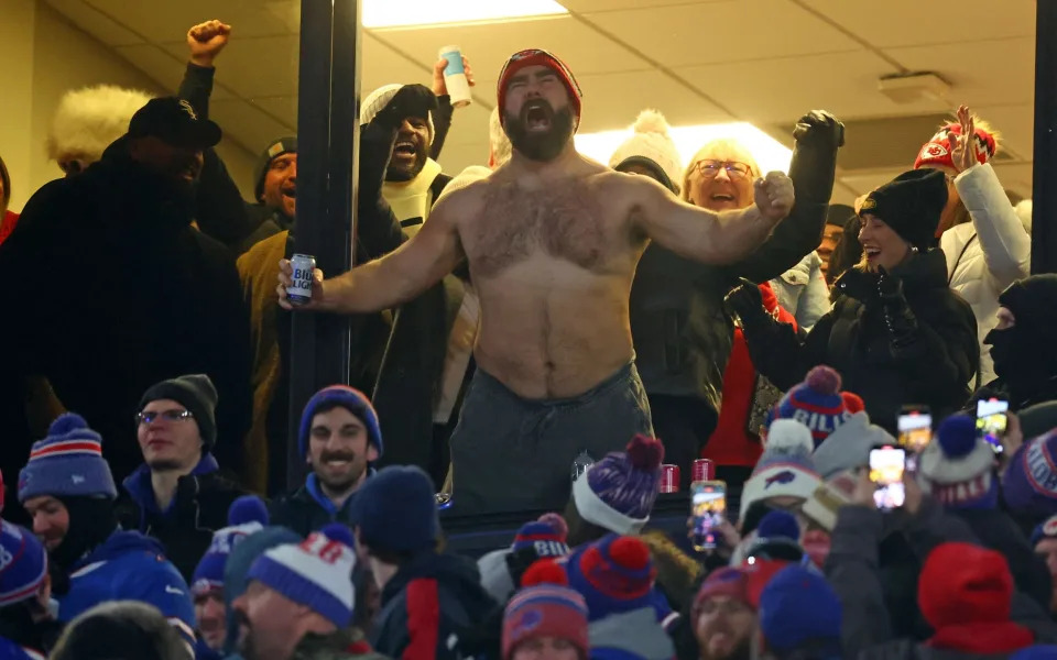 A shirtless Jason Kelce celebrates his brother’s touchdown