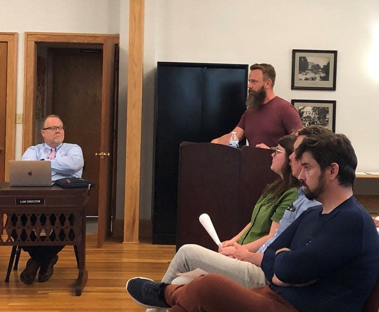 Adam Himes, the chair of the Munson Springs Steering Committee, share the group's development recommendations for a 57-acre site along Newark-Granville Road during the July 19 village council meeting.
