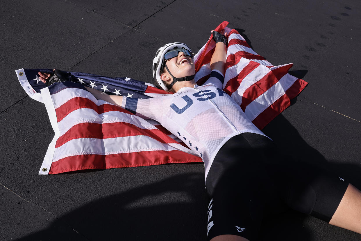 Kristen Faulkner, of the U.S., celebrates her victory after winning the women's cycling road race at the Paris Olympics on Sunday.