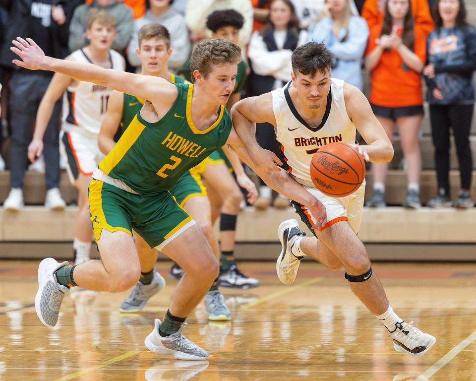 Ashton Tomassi (right) is Brighton's first two-time Livingston County boys basketball Player of the Year since 2002.