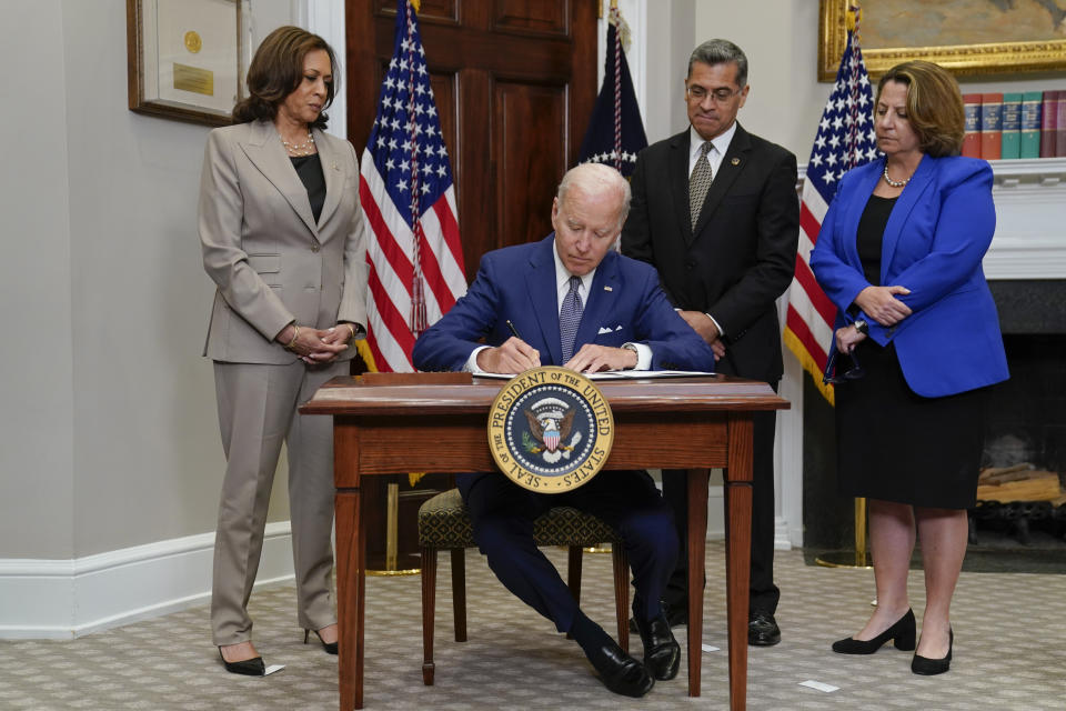 FILE - Health and Human Services Secretary Xavier Becerra, second from right, watches as President Joe Biden signs an executive order on abortion access during an event in the Roosevelt Room of the White House, Friday, July 8, 2022, in Washington. On Friday, Sept. 9, 2022, Becerra addressed a gathering of Planned Parenthood leaders from 24 states, in Sacramento, California. Also seen are From left, Vice President Kamala Harris, left, Health and Deputy Attorney General Lisa Monaco, right. (AP Photo/Evan Vucci, File)