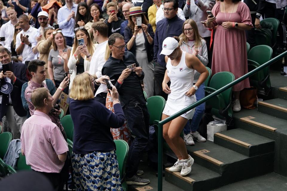 Australia's Ashleigh Barty celebrates after defeating Czech Republic's Karolina Pliskova during the women's singles final match against on day twelve of the Wimbledon Tennis Championships in London, Saturday, July 10, 2021. (AP Photo/Alberto Pezzali)