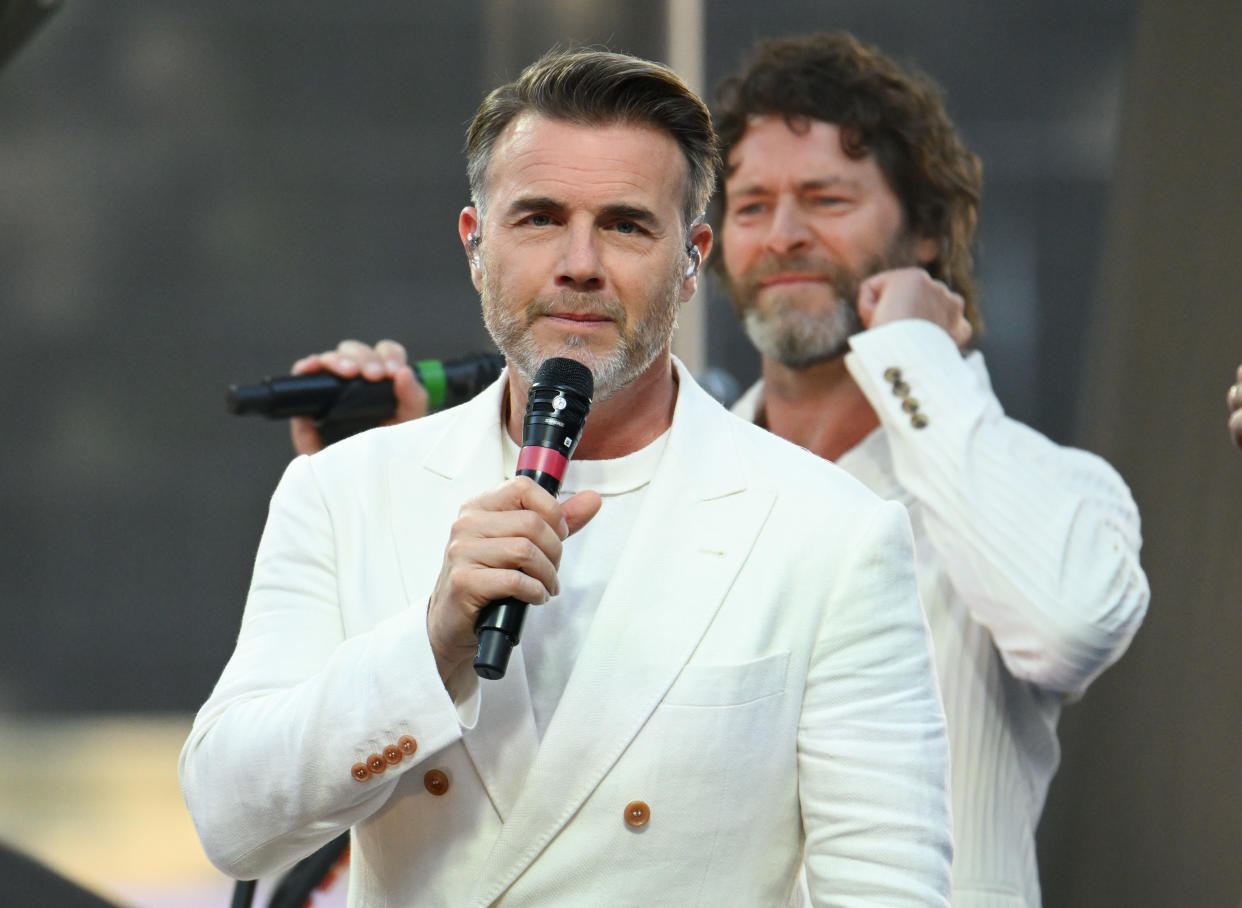 LONDON, ENGLAND - JUNE 15: Gary Barlow and Howard Donald of Take That, perform onstage at Take That's 
