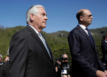 U.S. Secretary of State Rex Tillerson (L) and Italy's Foreign Minister Angelino Alfano arrive to attend a ceremony at the Sant'Anna di Stazzema memorial, dedicated to the victims of the massacre committed in the village of Sant'Anna di Stazzema by Nazis in 1944 during World War II, Italy April 10, 2017. REUTERS/Max Rossi