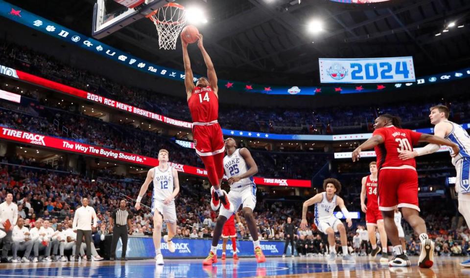 N.C. State’s Casey Morsell (14) heads to slam in two during N.C. State’s 74-69 victory over Duke in the quarterfinal round of the 2024 ACC Men’s Basketball Tournament at Capital One Arena in Washington, D.C., Thursday, March 14, 2024. Ethan Hyman/ehyman@newsobserver.com