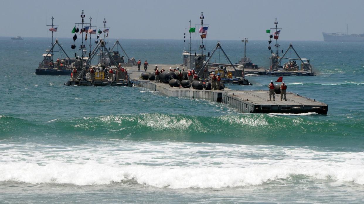 080721 n 1424c 254camp pendleton, calif july 21, 2008 the army trident pier makes its approach to gold beach during joint logistics over the shore jlots 2008 joint task force eight engages jlots under a joint force commander jfc as a means to load and unload ships without the benefit of deep draft capable, fixed port facilities us navy photo by mass communication specialist 2nd class brian p caraccireleased