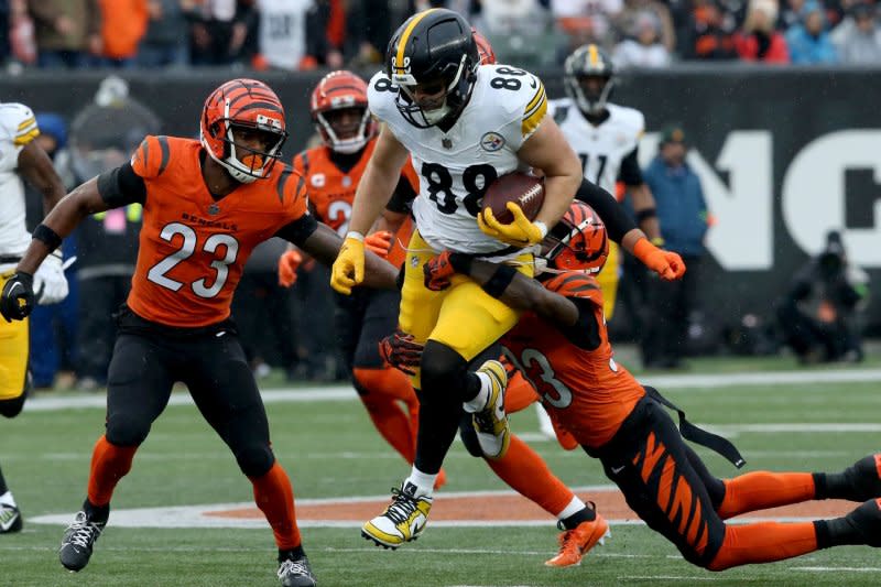 Pittsburgh Steelers tight end Pat Freiermuth (88) gets tackled by Cincinnati Bengals defenders Sunday at Paycor Stadium in Cincinnati. Photo by John Sommers II/UPI